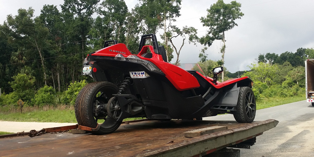 Image of a Three-Wheeled Motorcycle Being Towed